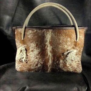 Handmade leather tote with reclaimed lariat rope handles